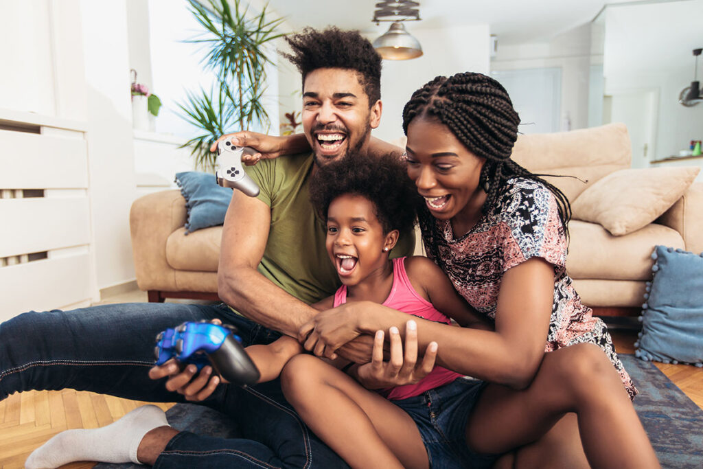 family placing video games together